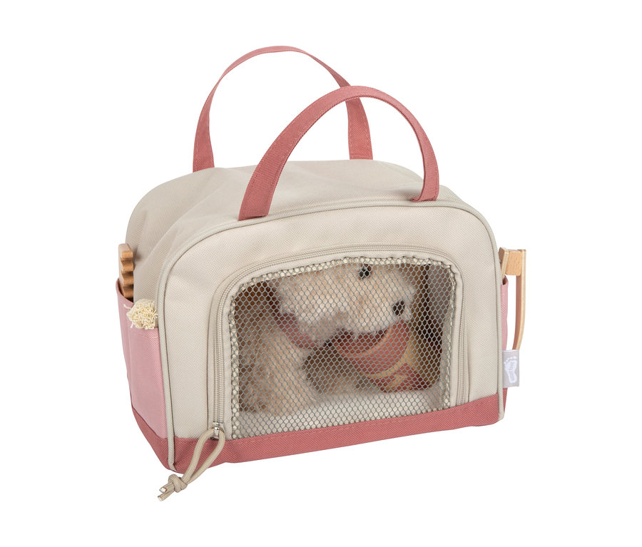 small foot Plüschhund mit Tasche und Pflege-Set: Eine beige-rosafarbene Tragetasche mit einem Plüschhund und Pflegezubehör in den Seitentaschen.