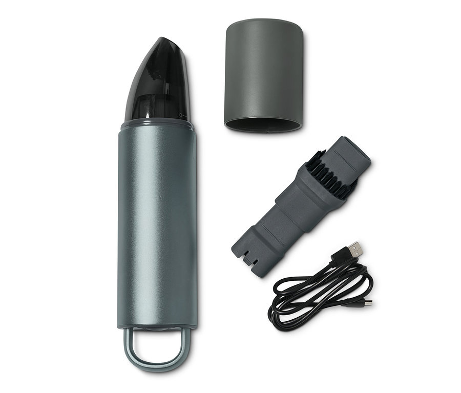 Grauer Design-Akkusauger mit Aufsätzen und Ladekabel.