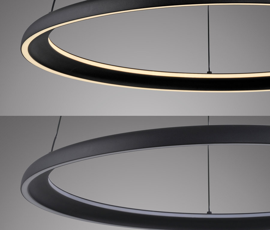 Zwei kreisförmige, schwarze LED-Leuchten hängen von der Decke.