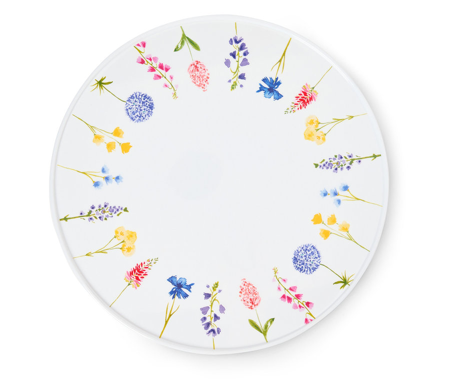 Weißer Teller mit aufgemalten Blumen am Rand.