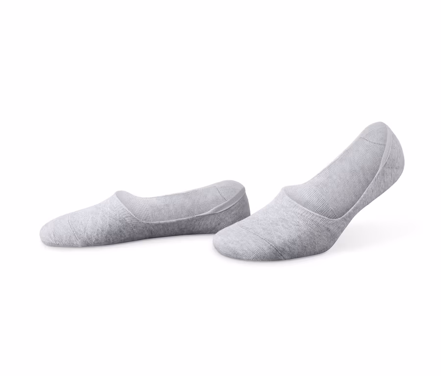 Zwei Paar graue Sneaker-Füßlinge.