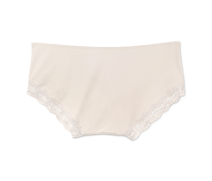 Ein Paar cremefarbene Pantys mit weißer Spitze.