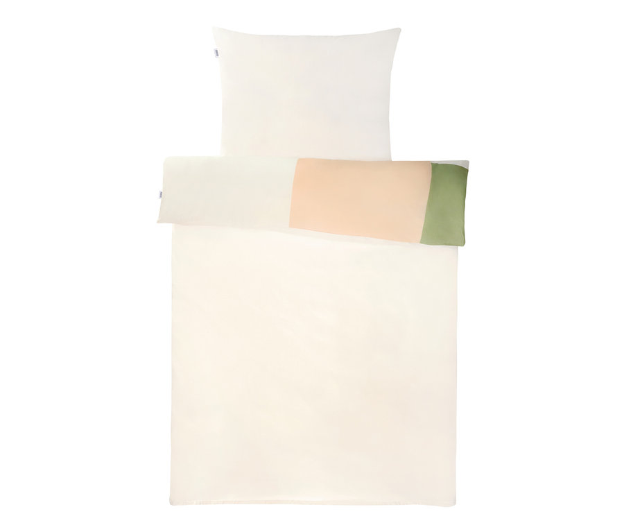 Beige Bettwäsche und Kissen mit Farbblöcken.
