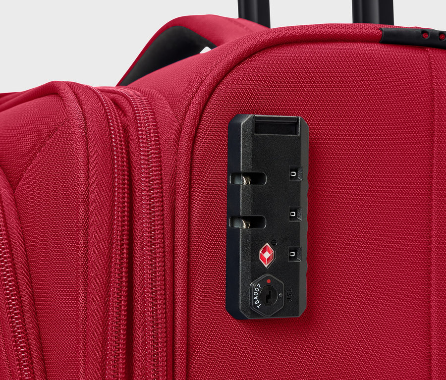 Nahaufnahme eines roten Koffers mit Zahlenschloss.